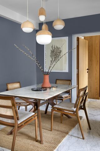 A dining room with pendant lights