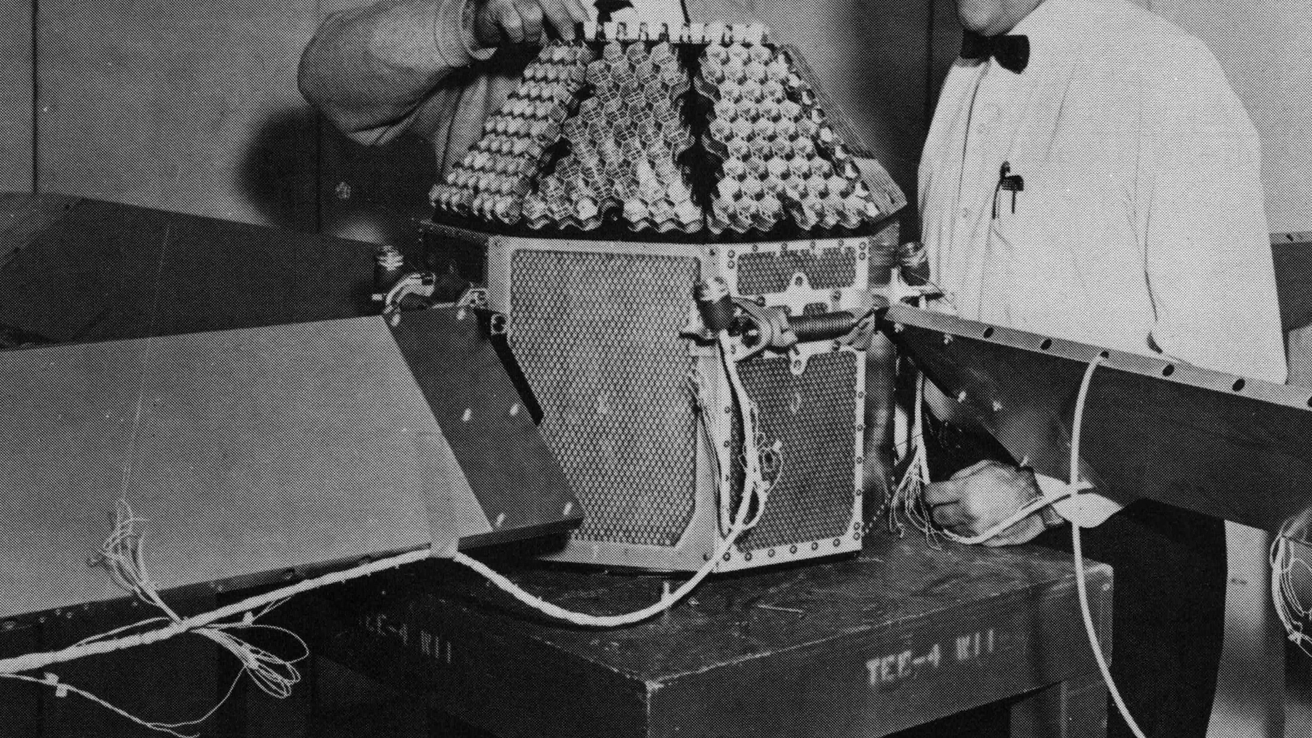 Technicians work on NASA's Beacon Explorer-A before its ill-fated launch.