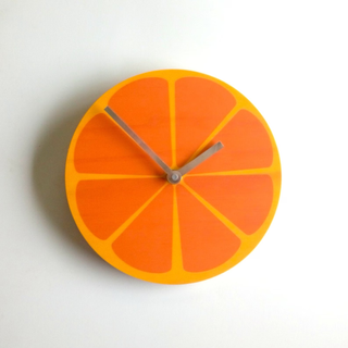 clock styled like cross section of an orange