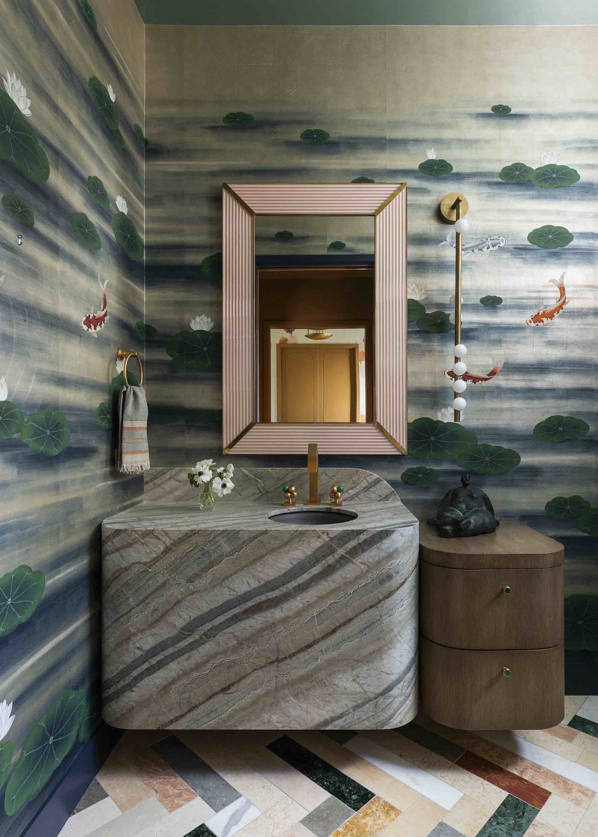 bathroom with colorful wallpaper and striped stone vanity
