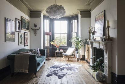 A living room with olive green ceiling