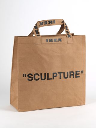 A brown paper bag that says IKEA on the handles and "sculpture" in black type on the front, created by Virgil Abloh