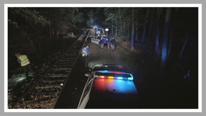 a crime scene at a train track in unsolved mysteries season 3