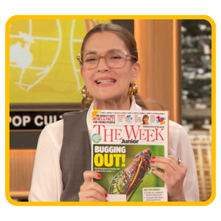 Image of Drew Barrymore holding a copy of The Week Junior magazine