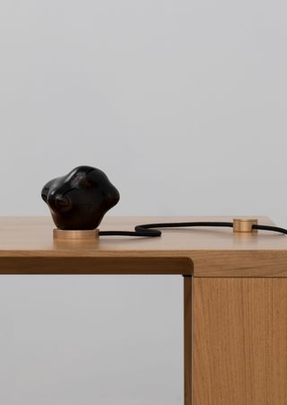 Small black lamp on table