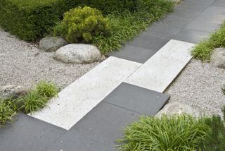 contrasting paving in a Japanese style garden