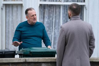 Harvey Monroe looks agitated as he talks to Dean Wicks outside his home.