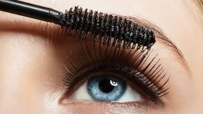 Make-up blue eye with long lashes with black mascara - stock photo
