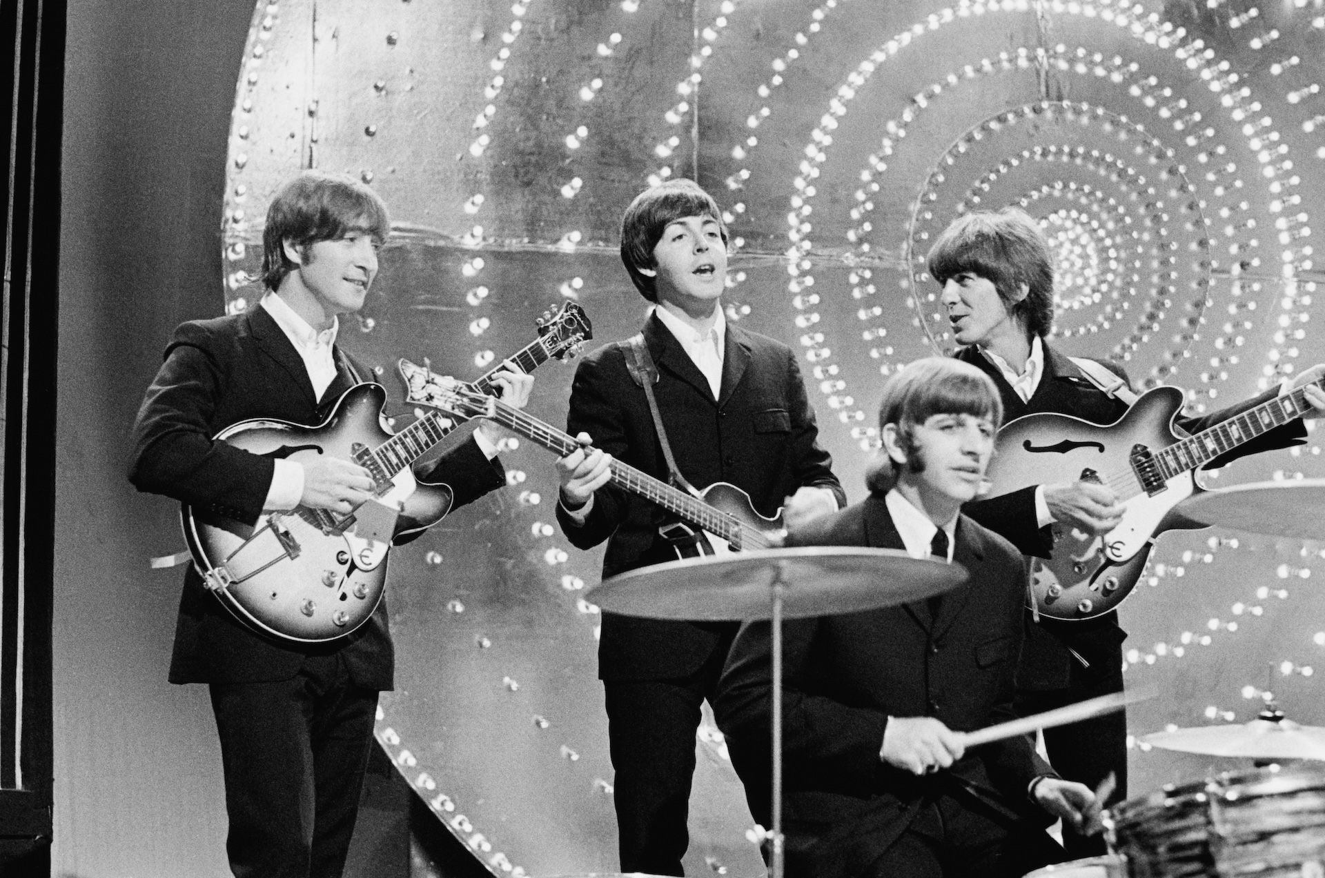 The Beatles perform 'Rain' and 'Paperback Writer' on BBC TV show 'Top Of The Pops' in London on 16th June 1966. Left to right: John Lennon (1940-1980), Paul McCartney, Ringo Starr and George Harrison (1943-2001).