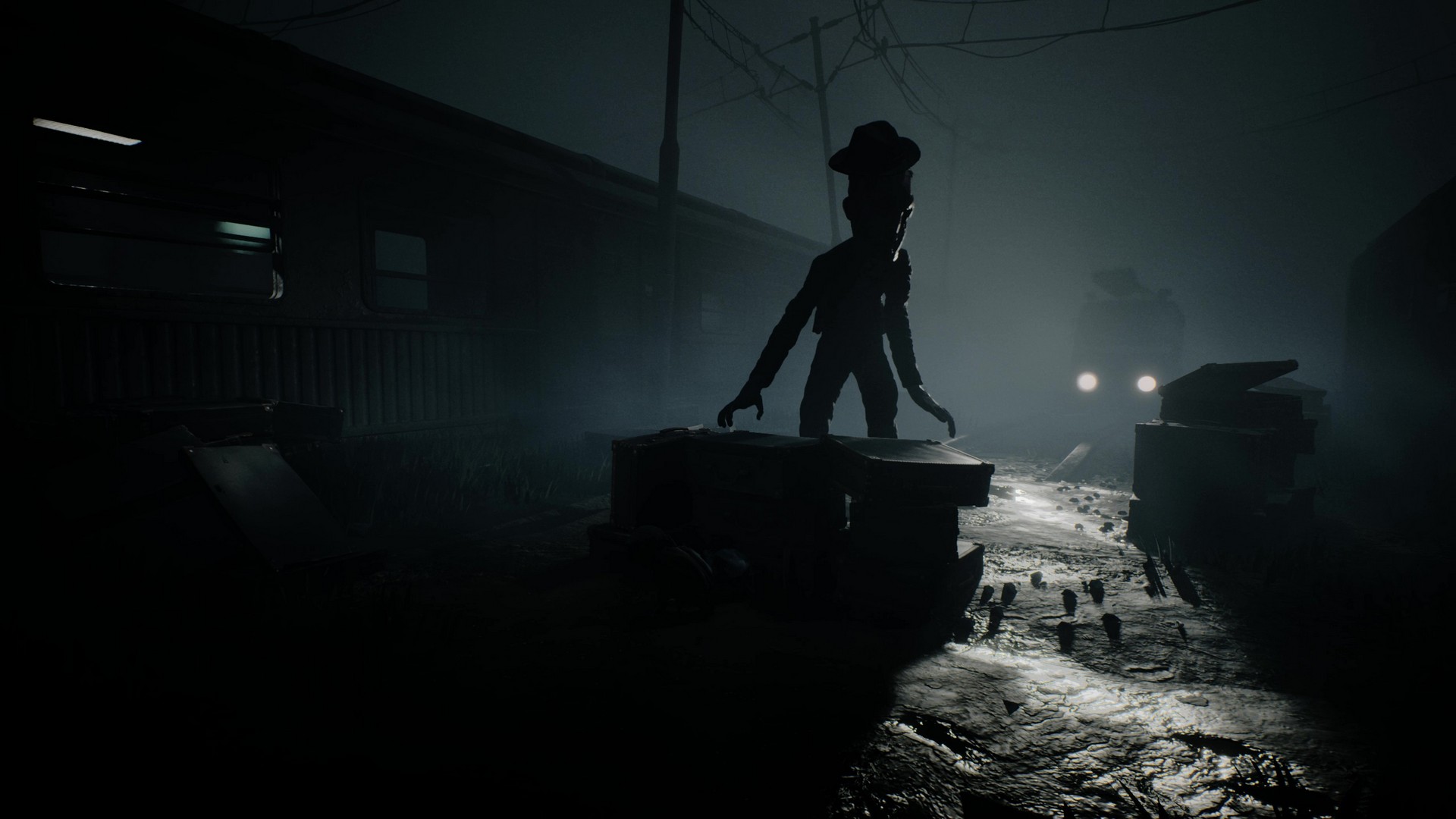 A humanoid creature searches for the siblings in a train yard in Reanimal, lit only by the headlights of a van in the background