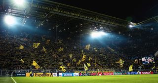 Borussia Dortmund tickets: How to get Dortmund tickets for Signal Iduna Park: A general view of the Yellow Wall at Signal Iduna Park, the home stadium of Borussia Dortmund during the Group A match of the UEFA Champions League between Borussia Dortmund and Club Brugge at Signal Iduna Park on November 28, 2018 in Dortmund, Germany.
