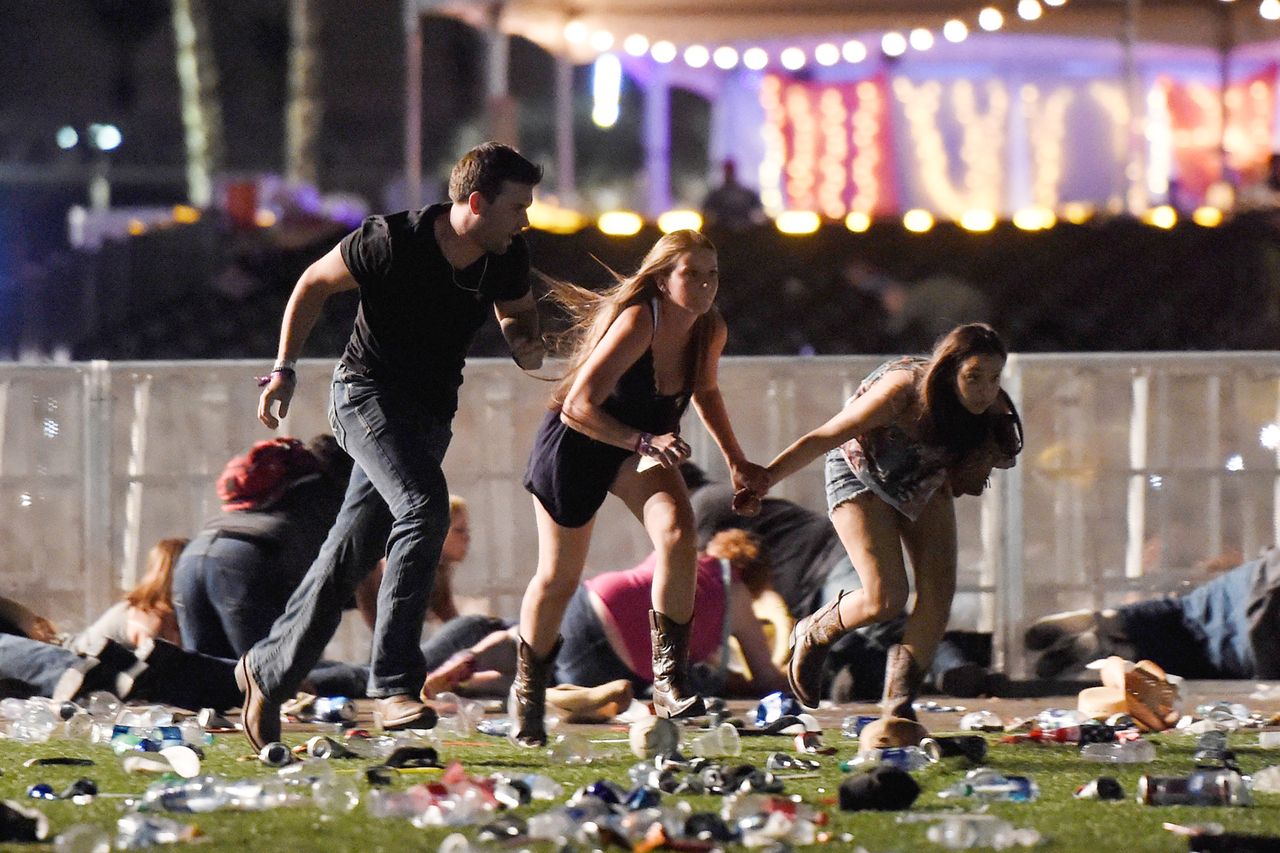 Concertgoers flee the scene.