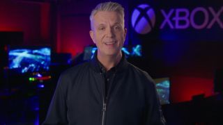 Matt Booty speaking with an Xbox sign in the background