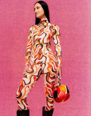 Woman in colourful psychedelic Marni Uniqlo catsuit