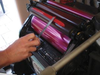 Here's the pink ink going onto the rollers before the pressing is done.