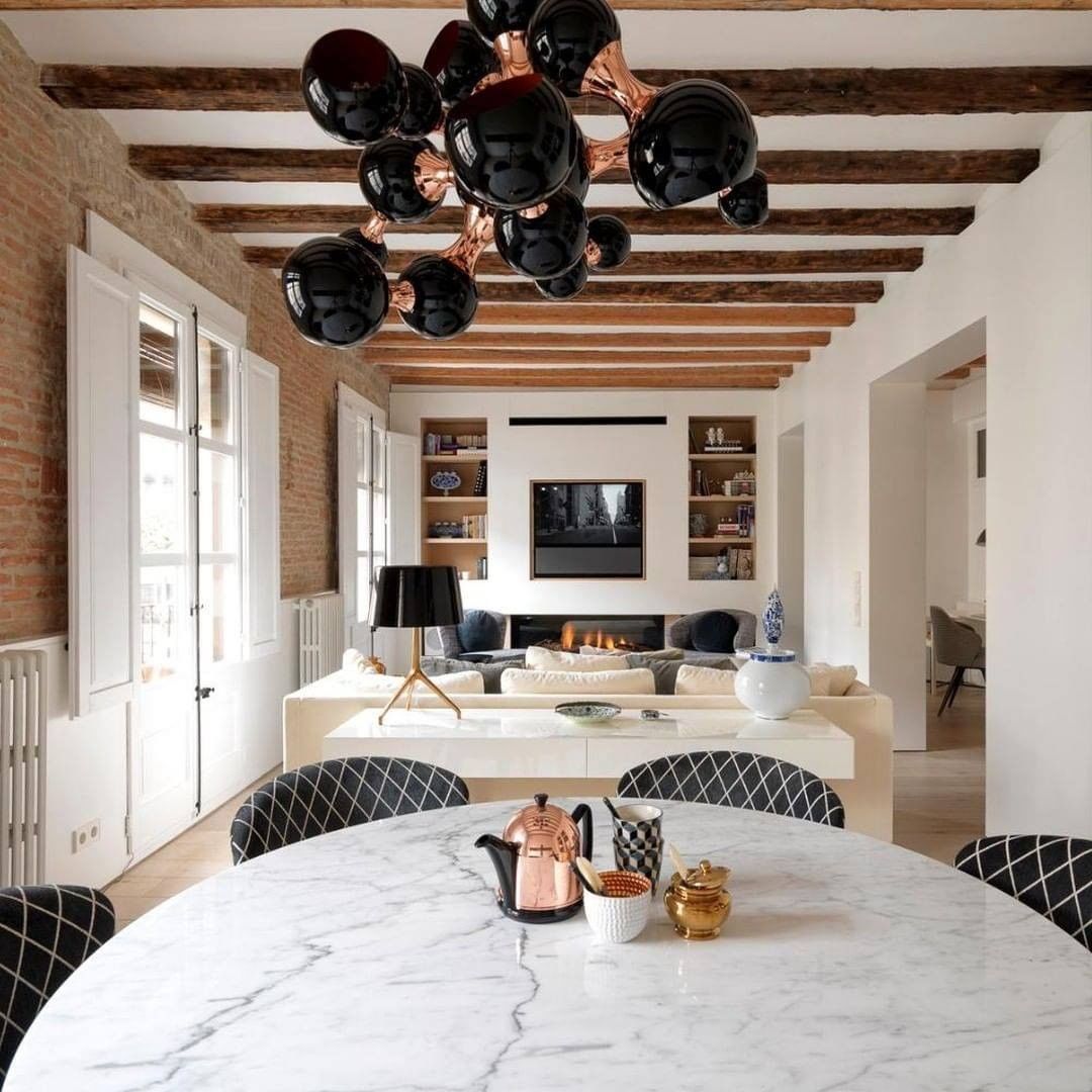 Exposed wooden beams feature in this living space