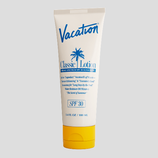 Vacation SPF 30 sunscreen in white bottle with blue print