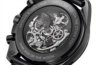 The Omega Speedmaster "Dark Side of the Moon" Apollo 8 chronograph features a skeletonized dial that reveals a blackened, laser-ablated movement, replicating the lunar surface.