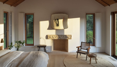 Warm minimal bedroom with neutral scheme, narrow windows and modern shutters