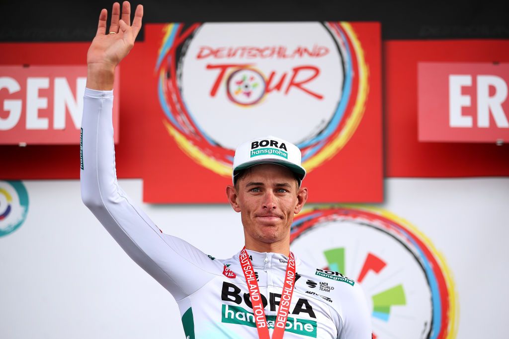 ERLANGEN GERMANY AUGUST 28 Nils Politt of Germany and Team Bora Hansgrohe celebrates winning the stage on the podium ceremony after the 35th Deutschland Tour 2021 Stage 3 a 1933km stage from Ilmenau to Erlangen DeineTour on August 28 2021 in Erlangen Germany Photo by Christian KasparBartkeGetty Images