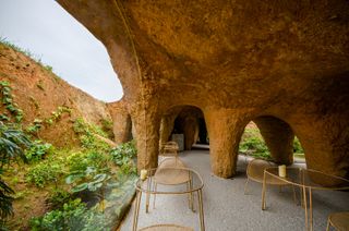 Tables at cave-like house and restaurant by Junya Ishigami in japan