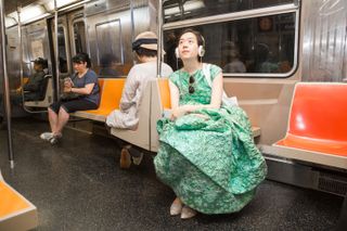Wearing Gown Whilst Sitting on the Subway Train