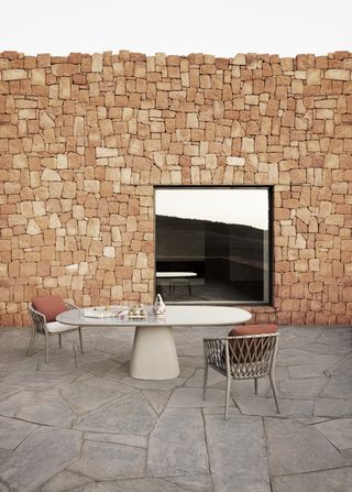 B&B Italia outdoor furniture launched in 2023: table and chairs in courtyard