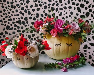 A pumpkin decorating idea using two ghost pumpkins as a DIY pumpkin vase with marker pen decor and dotted animal print wall decor