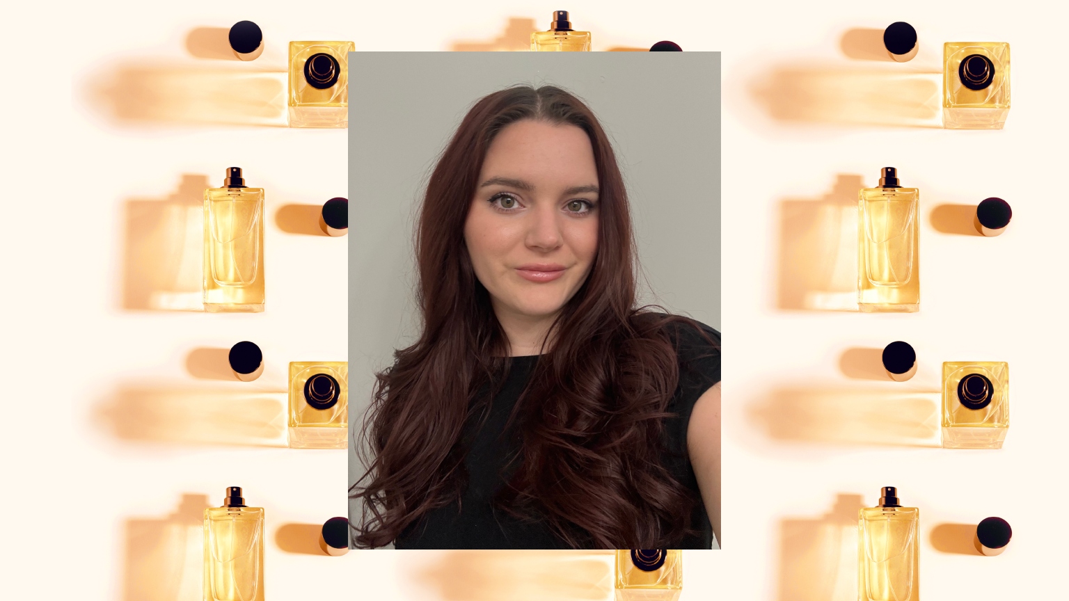 a woman with red hair and a black t shirt over a gold and black perfume bottle design