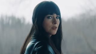 Lowen Ashleigh (Dakota Johnson) looks over her shoulder while in Verity Crawford's house in Verity.