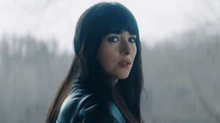 Lowen Ashleigh (Dakota Johnson) looks over her shoulder while in Verity Crawford's house in Verity.