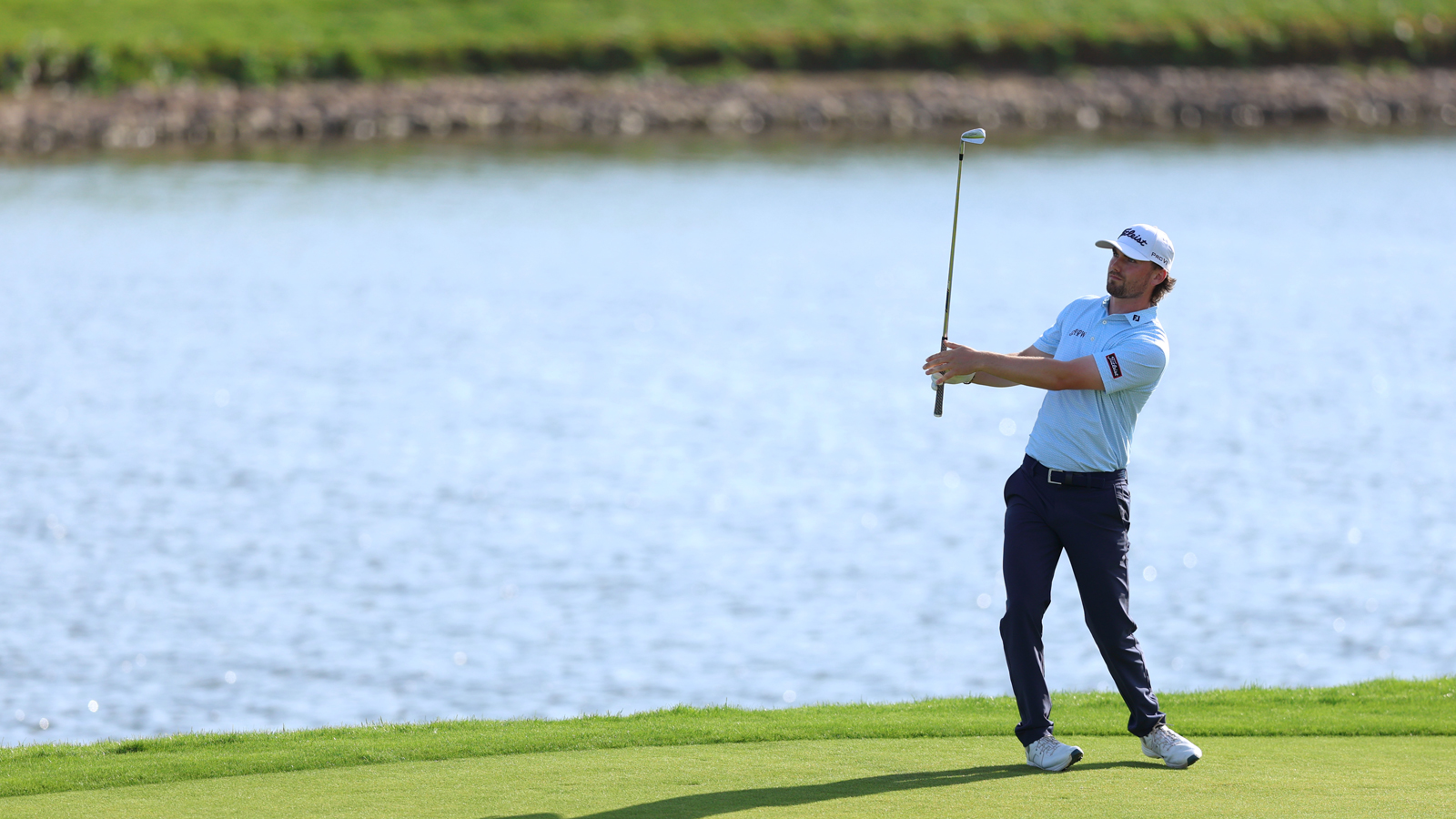 Cameron Adam hits an approach shot