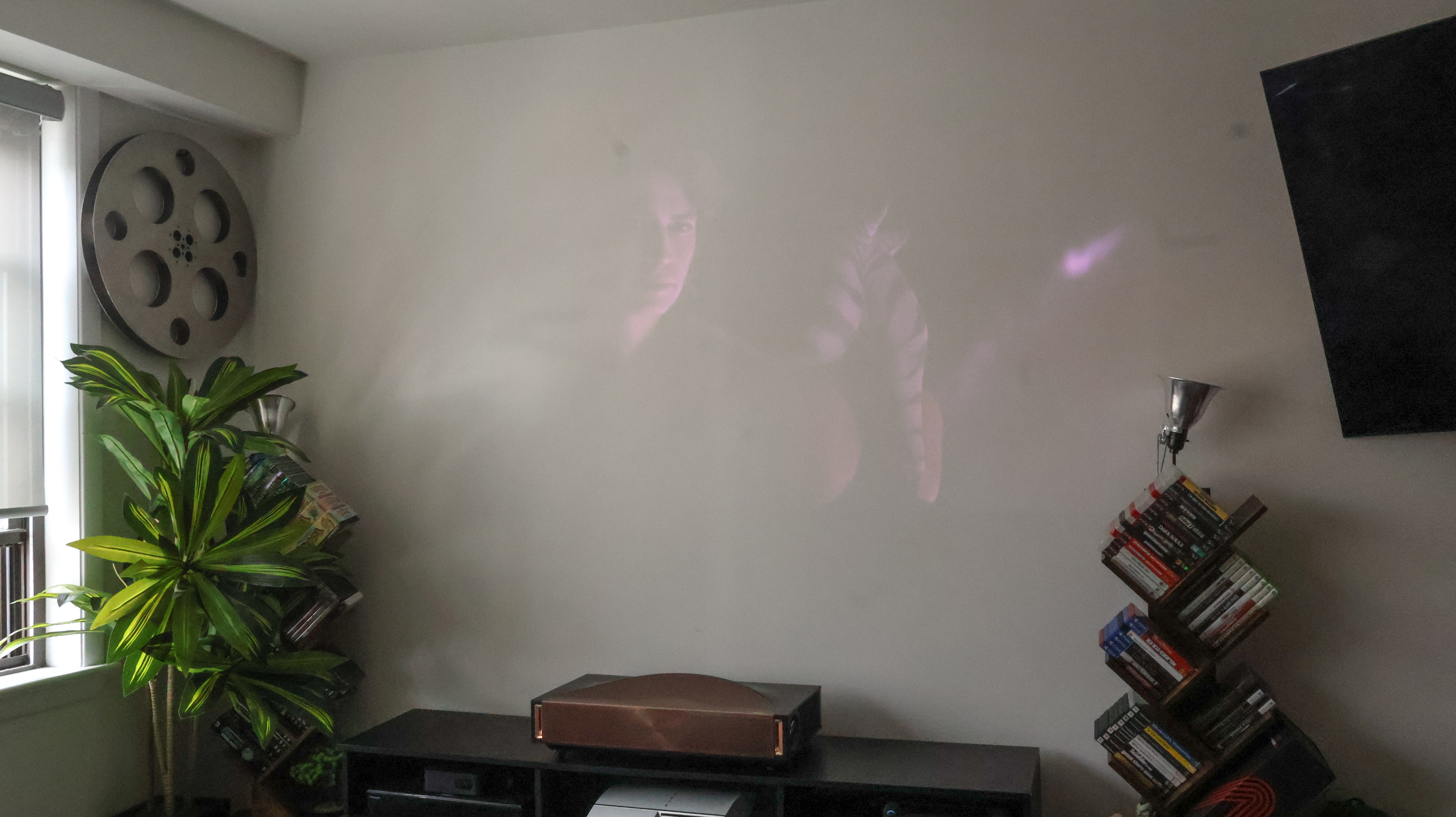 The Hisense L9Q UST projector in a living room