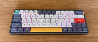 Nuphy Air60 keyboard on wooden desk