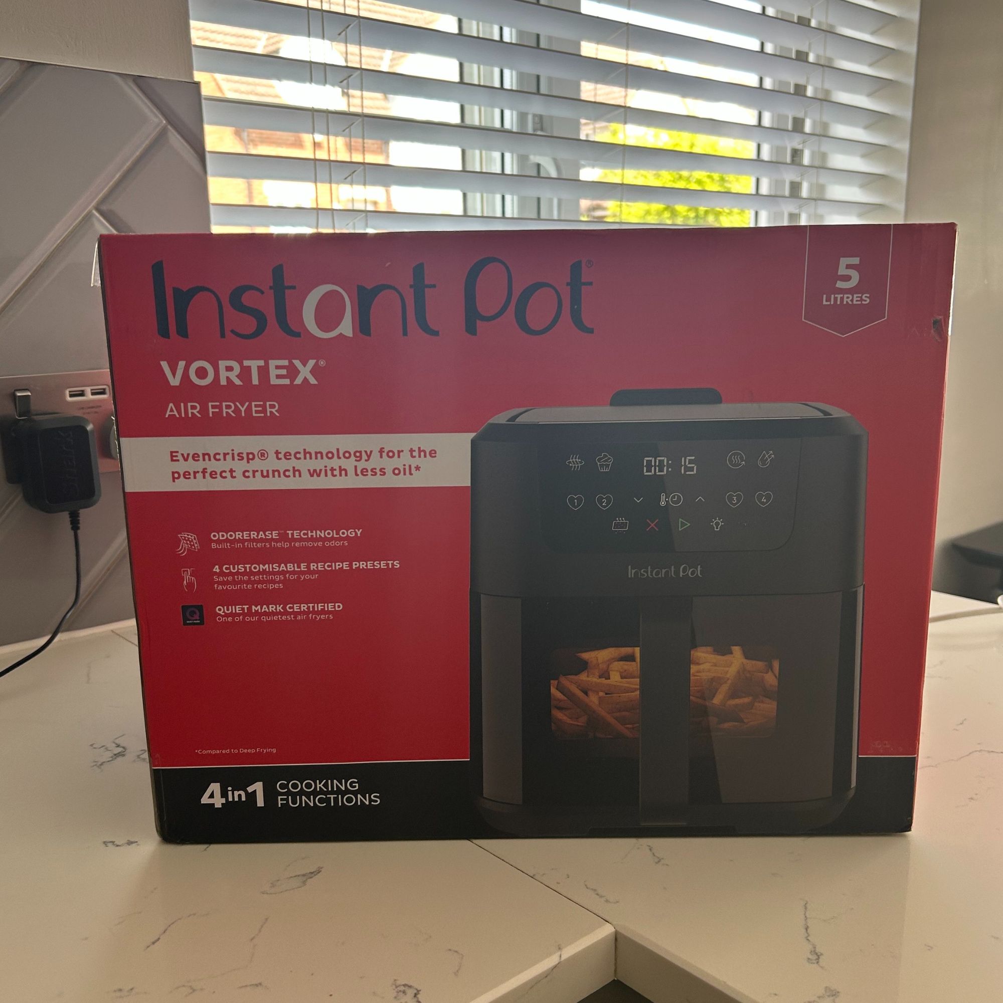 Instant Pot Vortex Compact 5L Air Fryer in box on kitchen worktop