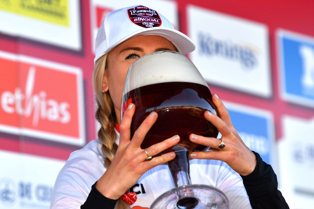 ZONHOVEN BELGIUM OCTOBER 24 Denise Betsema of The Netherlands and Team Pauwels Sauzen Bingoal celebrates at podium with a beer as race winner during the 25th Zonhoven UCI CycloCross Worldcup 2021 Womens Elite CXWorldCup UCIcyclocrossWC zonhoven on October 24 2021 in Zonhoven Belgium Photo by Luc ClaessenGetty Images