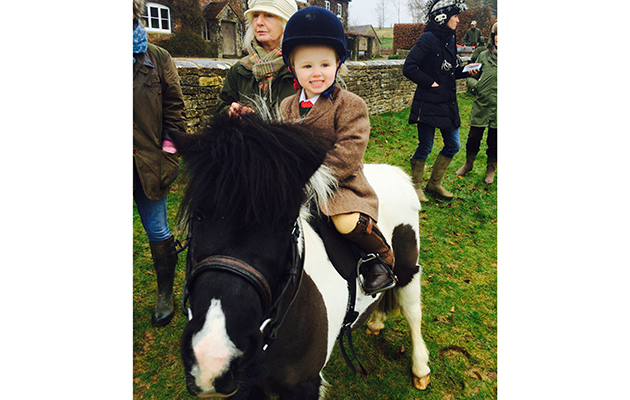 Two-year-old Martha Cope at her first meet mounded on Puddle with the Heythrop