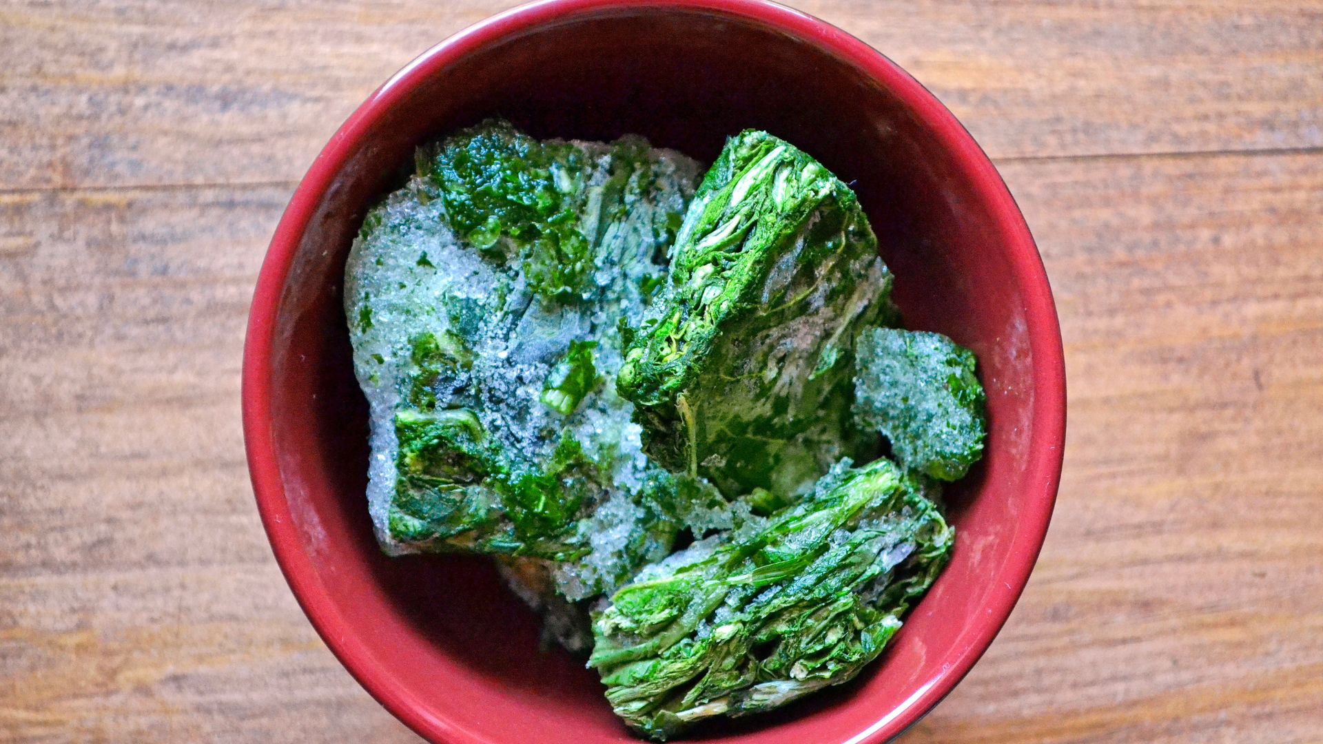 A bowl of frozen spinach