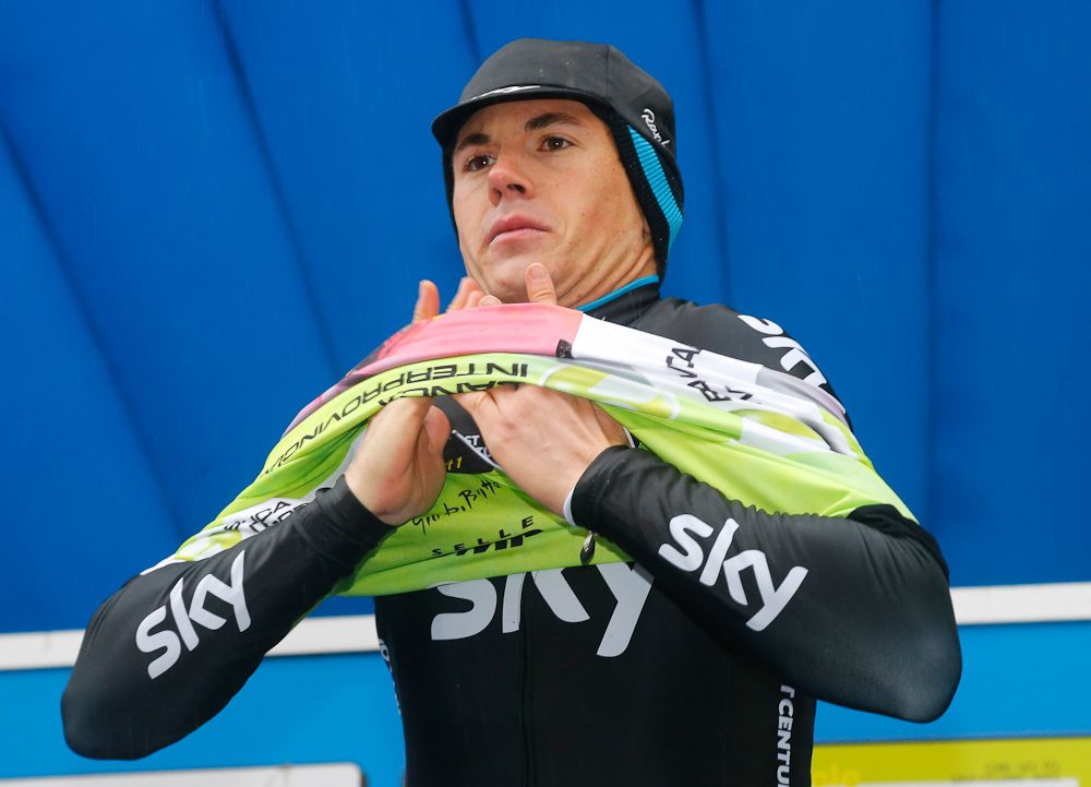 Ben Swift puts on the race leader's jersey.