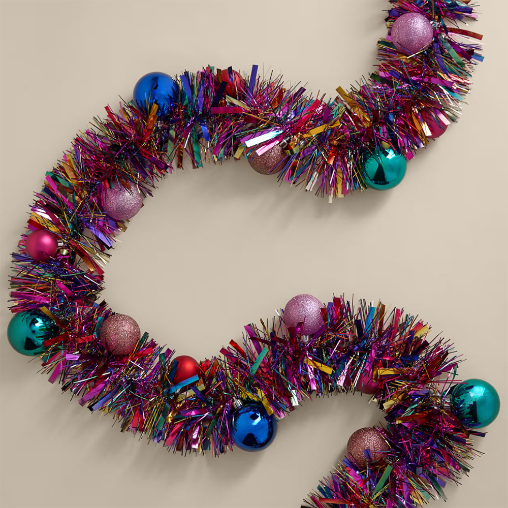 colourful tinsel with baubles