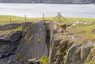 Steps cut out of the bare rock on Gokane headland, Crookhaven, West Cork, Ireland; they would have led to a subterranean cavern below that boats can still access.