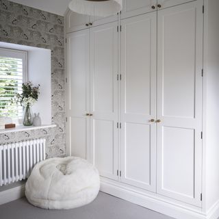 White fitted wardrobes in bedroom