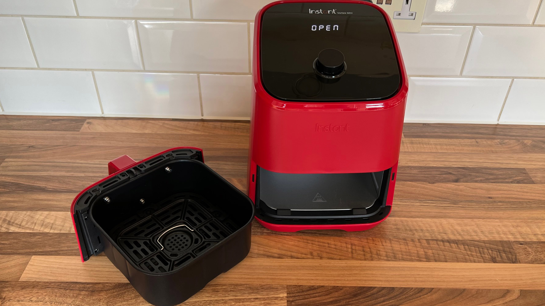 The Instant Vortex Mini with the basket removed on a kitchen countertop