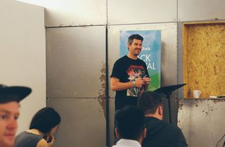 Co-founder Matt Dyke addresses the group on the hay bales