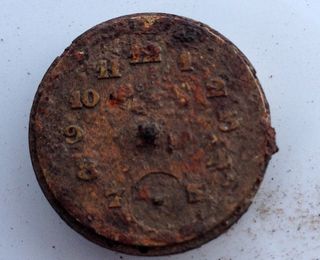 This rusted piece of a watch was also discovered at Sobibór.