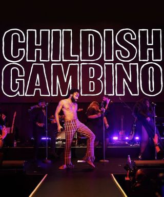 Childish Gambino on stage, below stylised lettering of his name