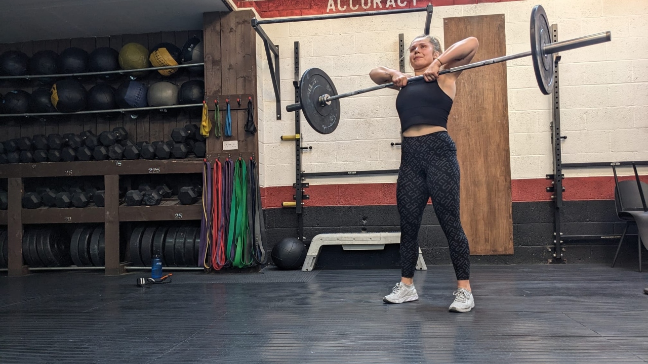 Emma Ray demonstrates the high pull with a barbell