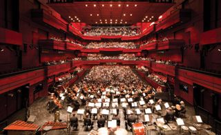 Inside of a concert hall with an orchestra
