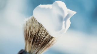 Shaving brush topped with shave foam