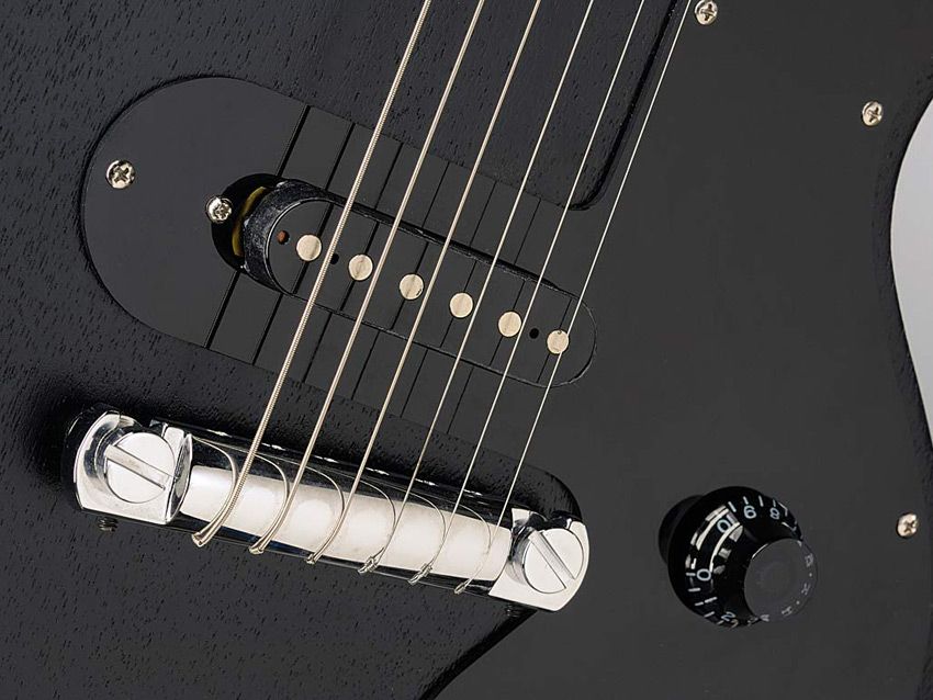 The hardware is basic: a wrapover bridge and uncovered single-coil